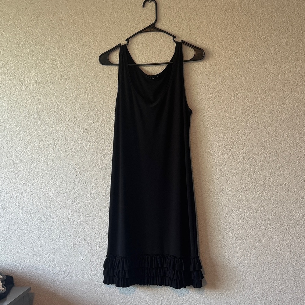 Elegant Black Sleeveless Dress With Ruffle at the Bottom